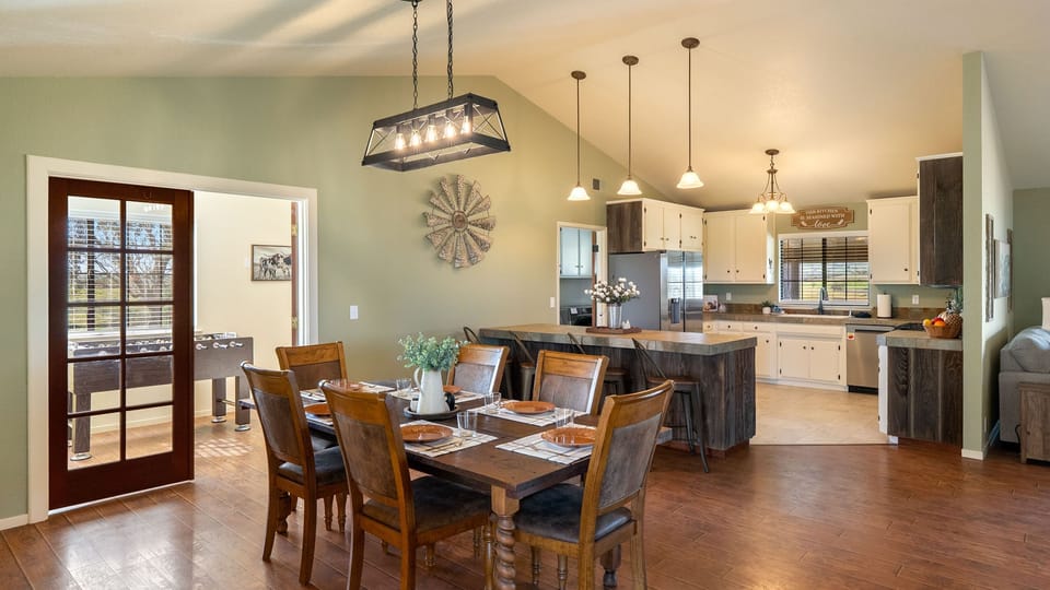 Dining table set beside the bright kitchen