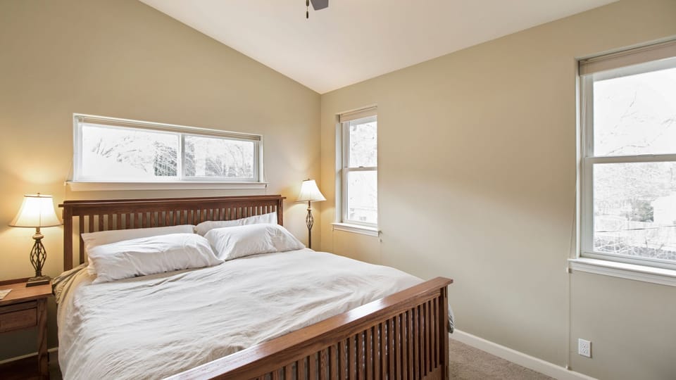 Rest easy in the king bed with soft light from every window