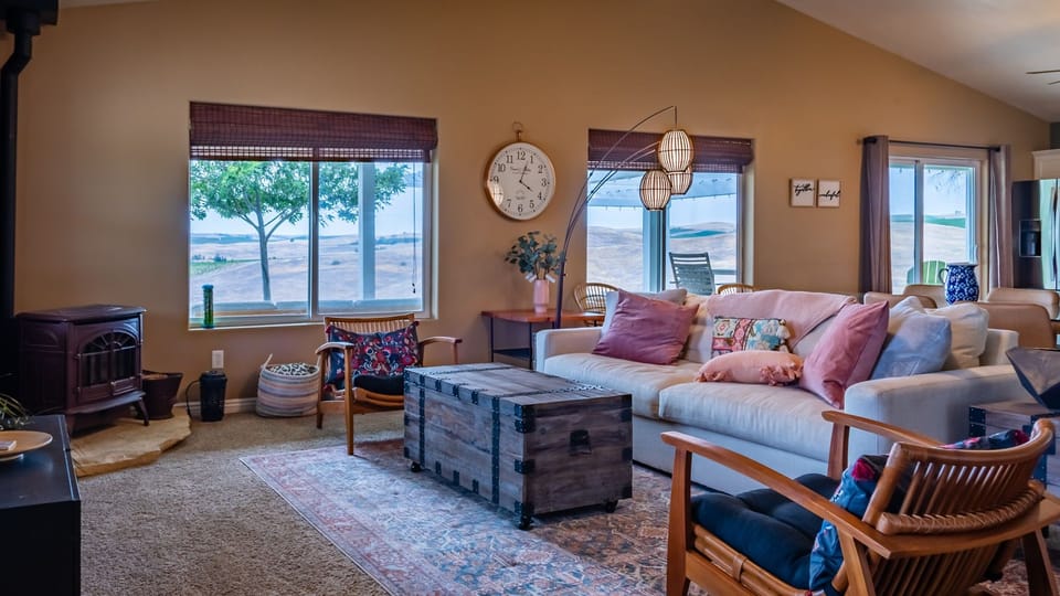 Unwind by the wood stove with wide-open views