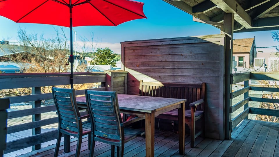 Gather for meals at the outdoor table under cover