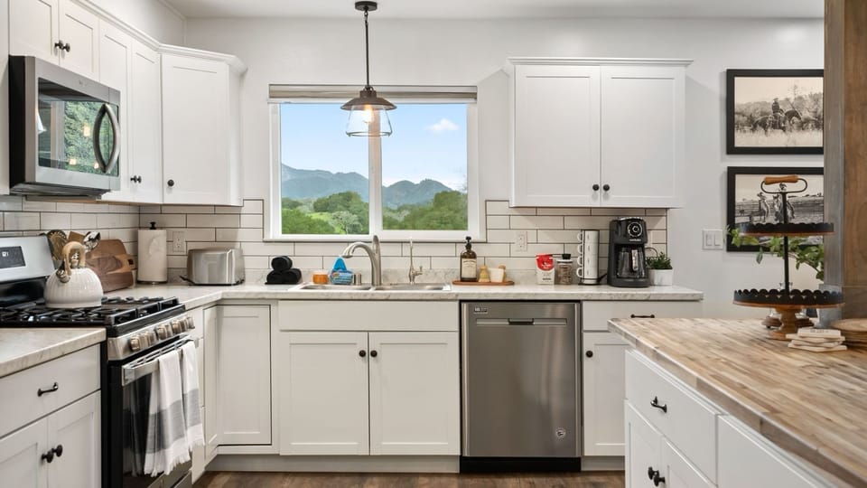 The kitchen keeps meal prep easy with mountain views