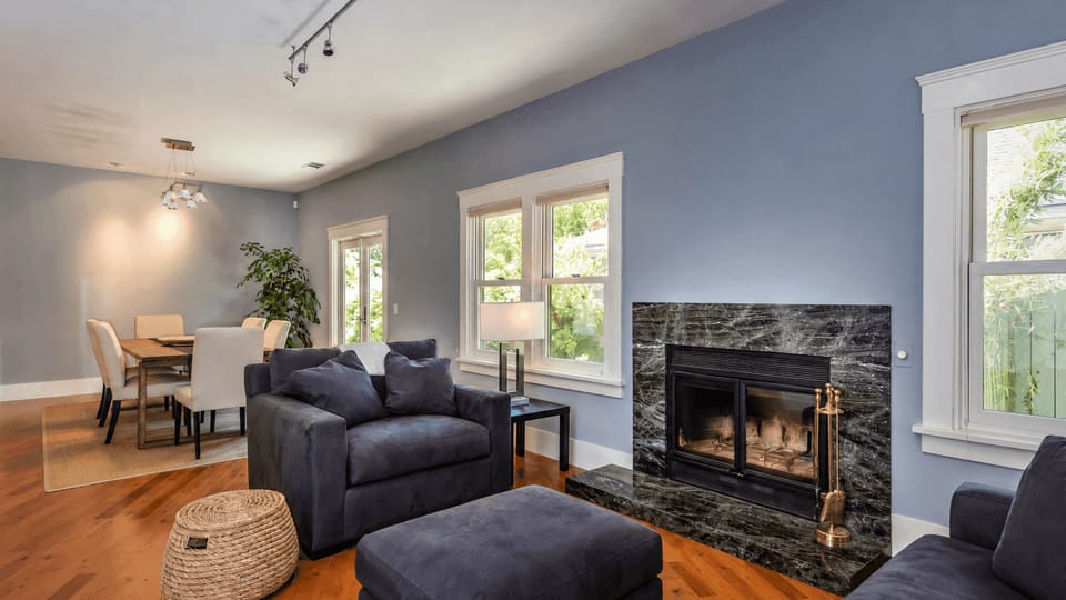 Gather by the fireplace in the open living space