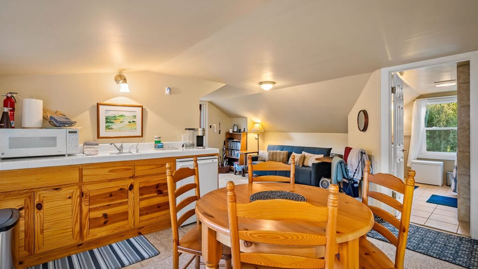 Open living and dining space with a compact kitchen nearby