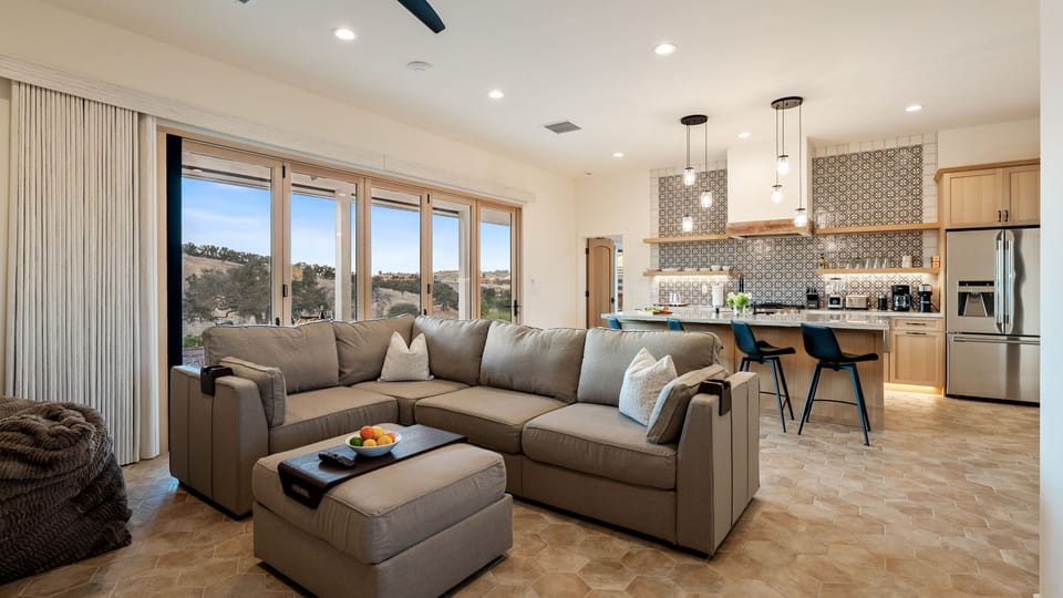 Gather around the island in the open concept lounge