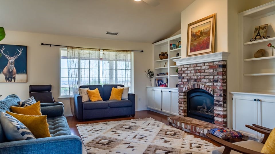 Gather by the fireplace in the living room
