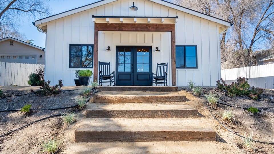 Rocking chairs and a shaded entry give the front porch a laid-back welcome