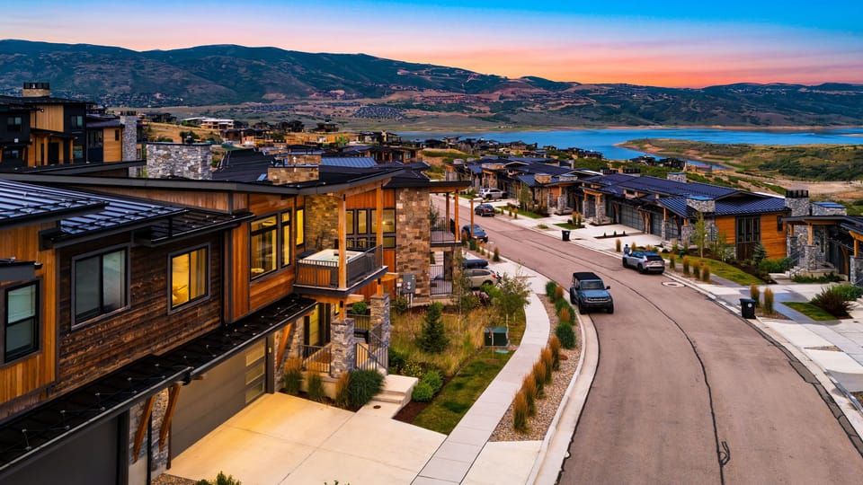 Aerial street-level view highlighting the home and neighborhood street.