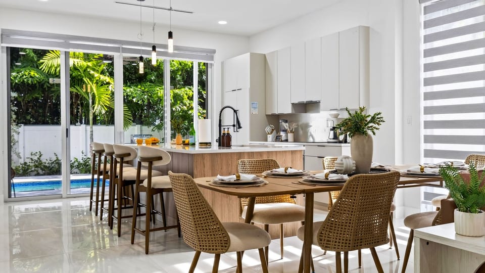 Gather for relaxed meals with the kitchen island and private pool just steps away.