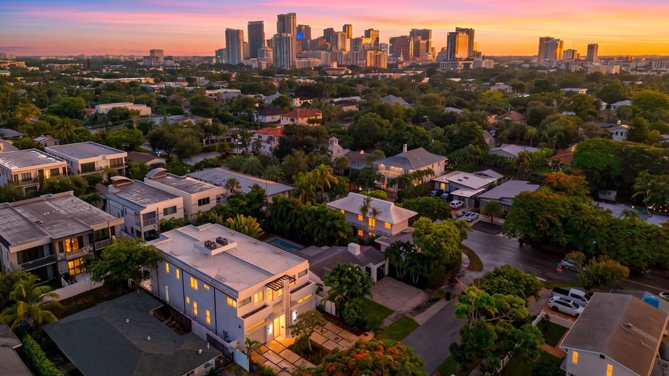 Sweeping sunset views reveal the city skyline beyond the surrounding neighborhood.