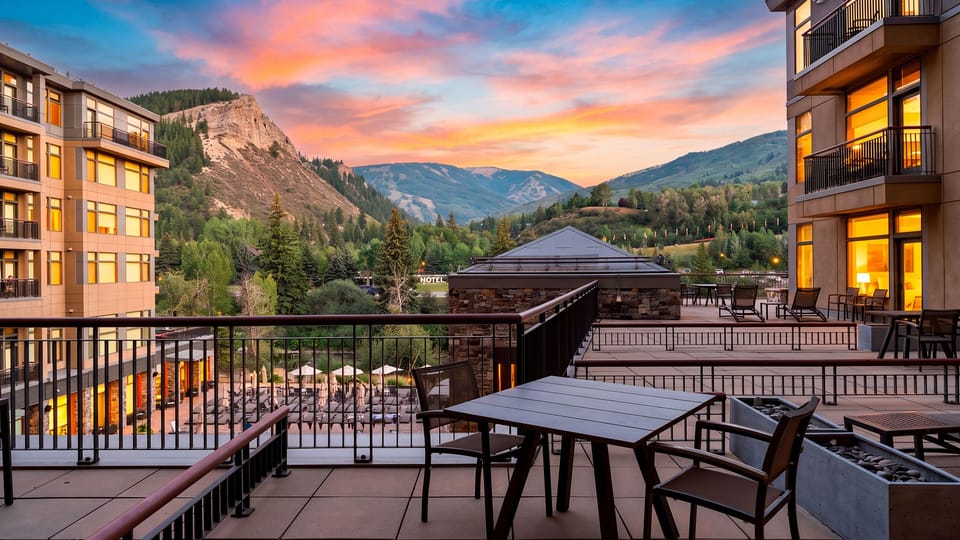 Take in sweeping mountain and valley views from the resort terrace as the sunset lights up the sky.