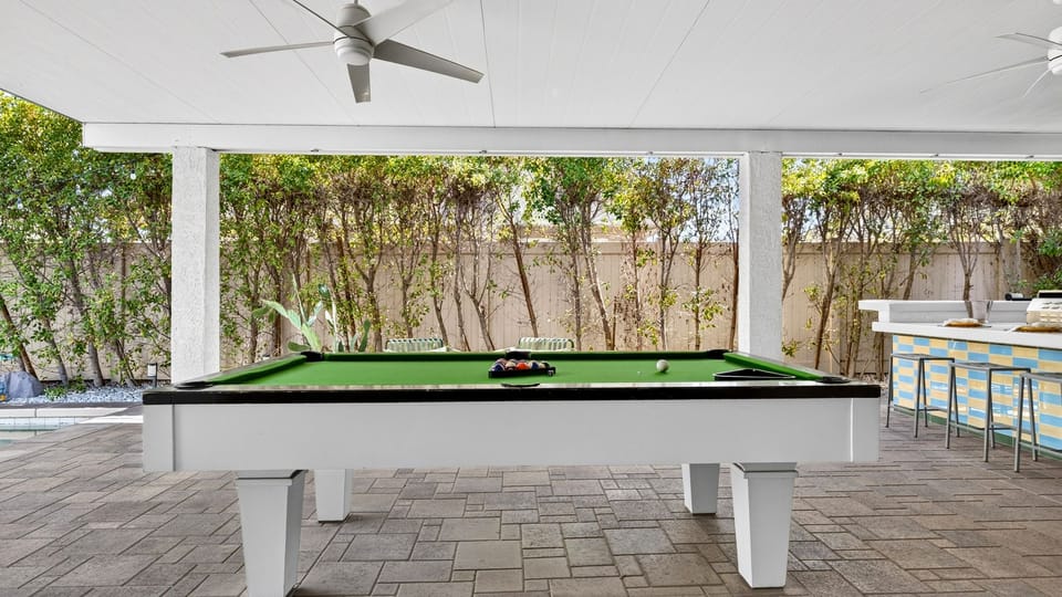 Indoor entertainment space centered around a professional billiard table.