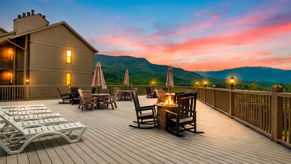Watch the mountains glow at sunset from the expansive shared deck, complete with fire pits, rocking chairs, and plenty of space to unwind.