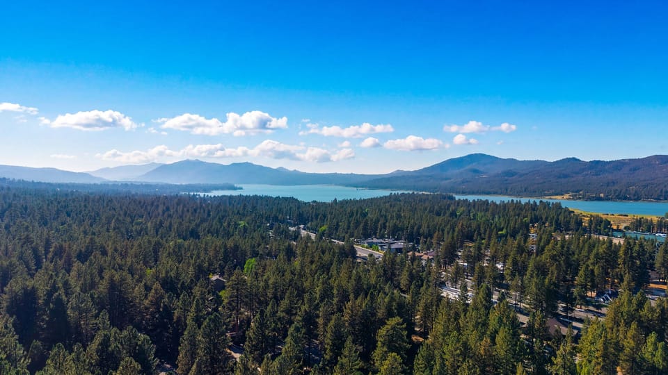 Sweeping views of the lake, pine forest, and surrounding mountains set the tone for a refreshing Big Bear getaway.