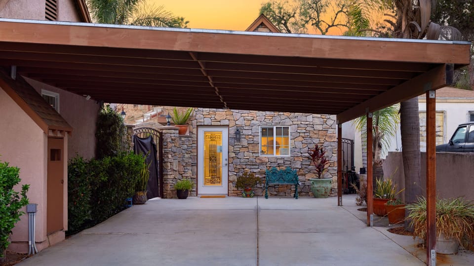 A charming stone cottage welcome with a peaceful courtyard and warm evening glow.