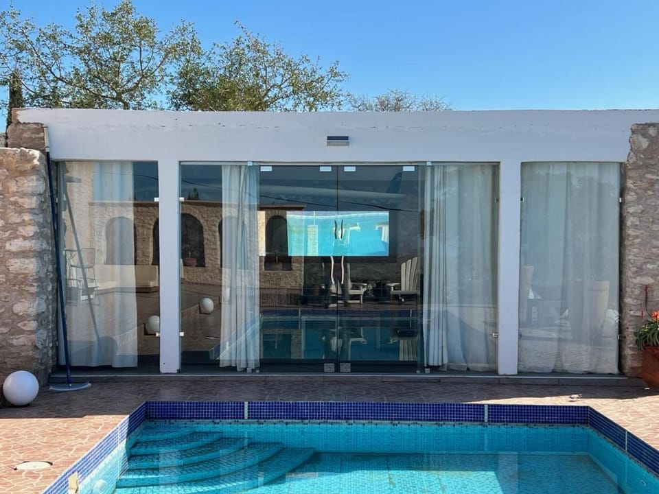 Property building, Patio, Pool view, Swimming pool, sunbed