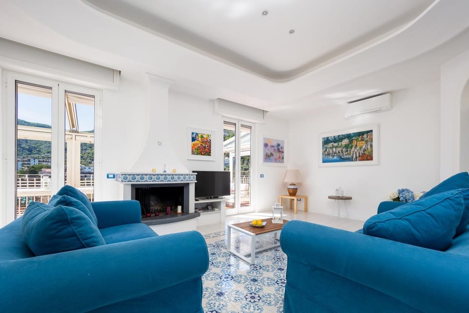 TV and multimedia, Balcony/Terrace, Living room, Seating area, fireplace, furniture, air conditioner
