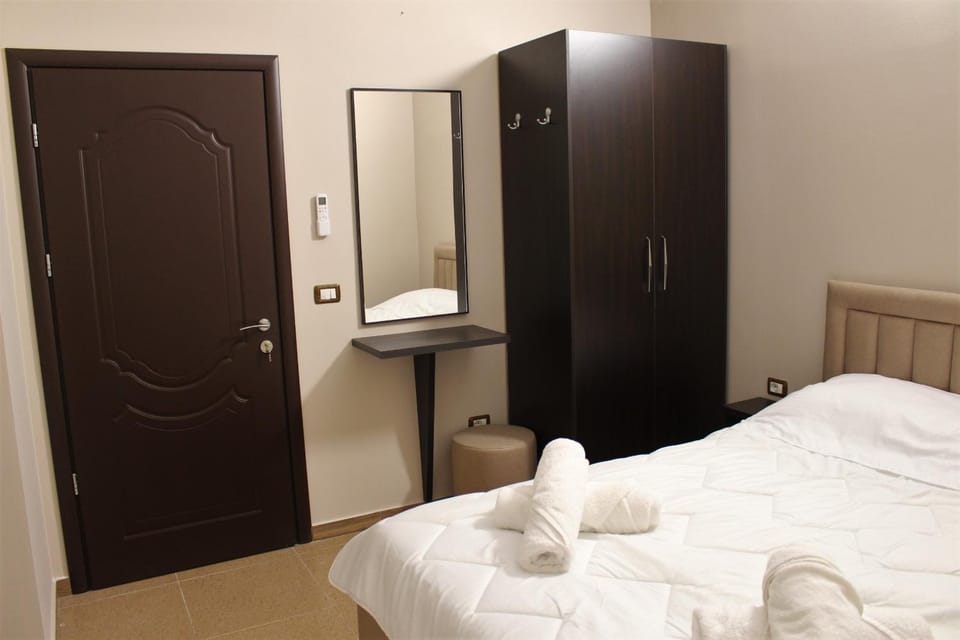 Bed, Photo of the whole room, towels, wardrobe
