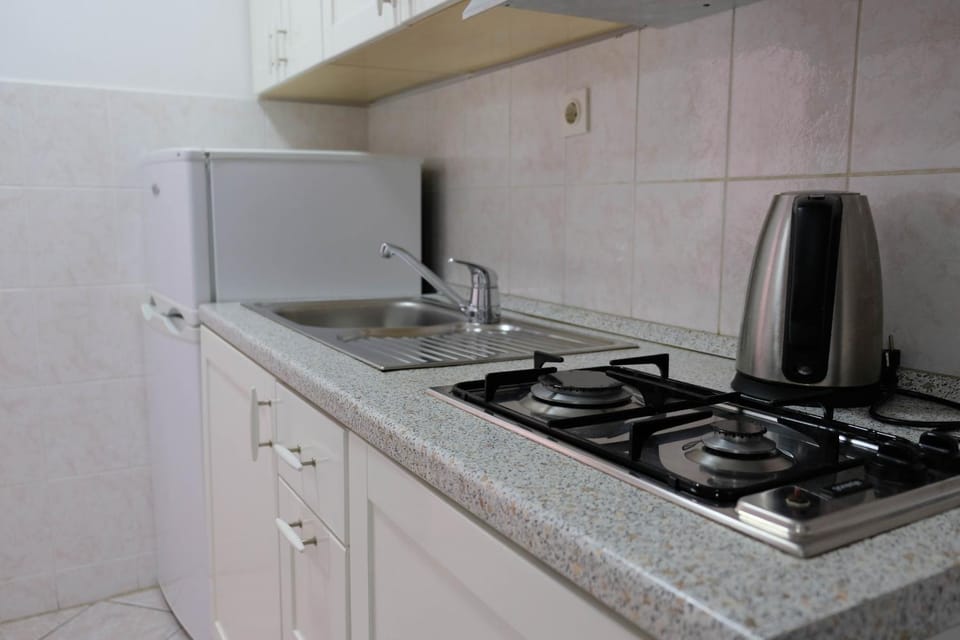 Kitchen or kitchenette, stove