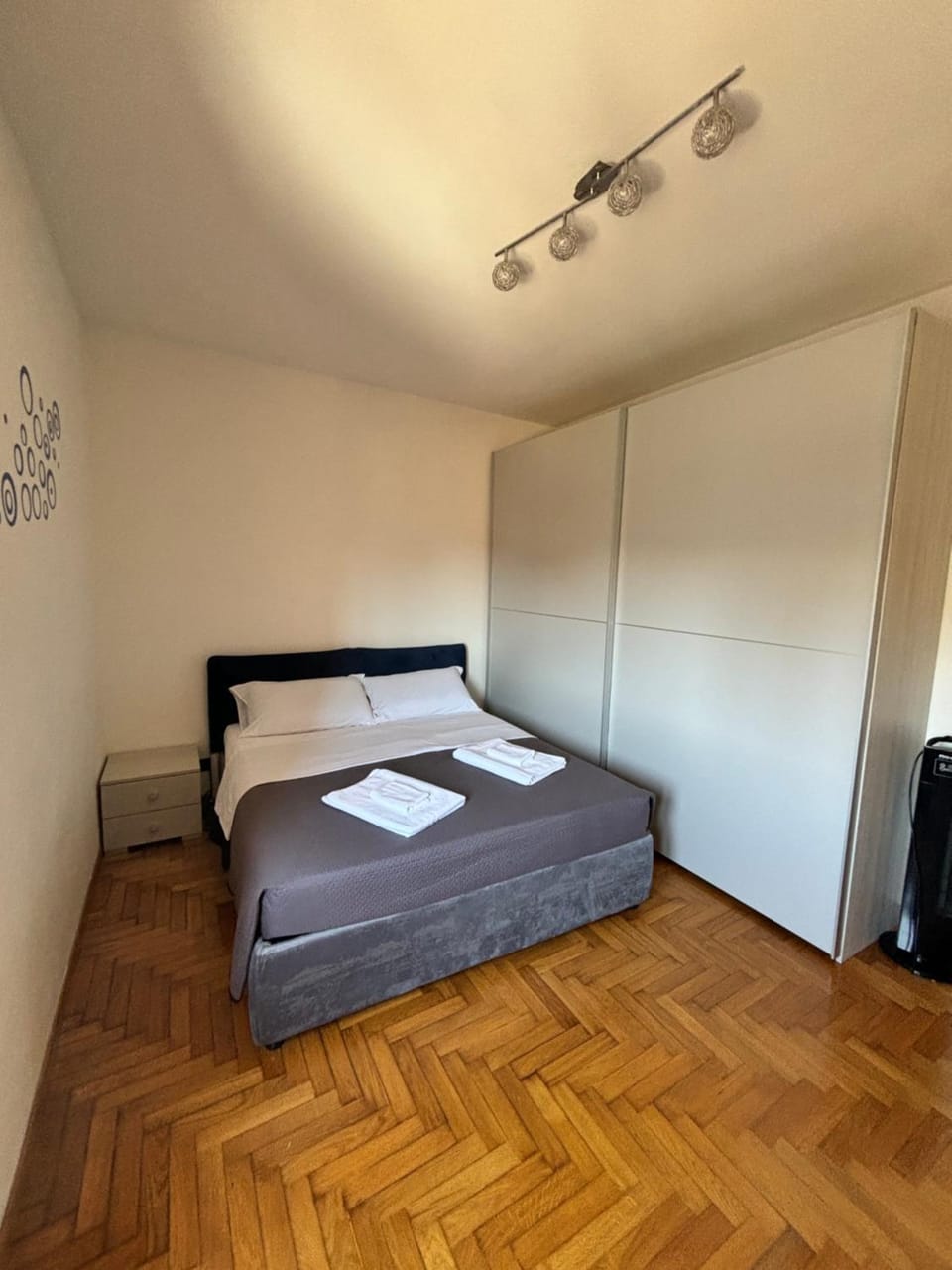 Bed, towels, wardrobe