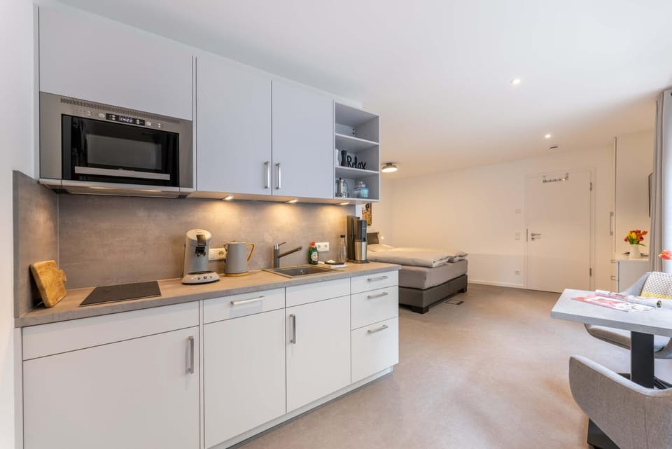 Kitchen or kitchenette, dishwasher, stove, toaster