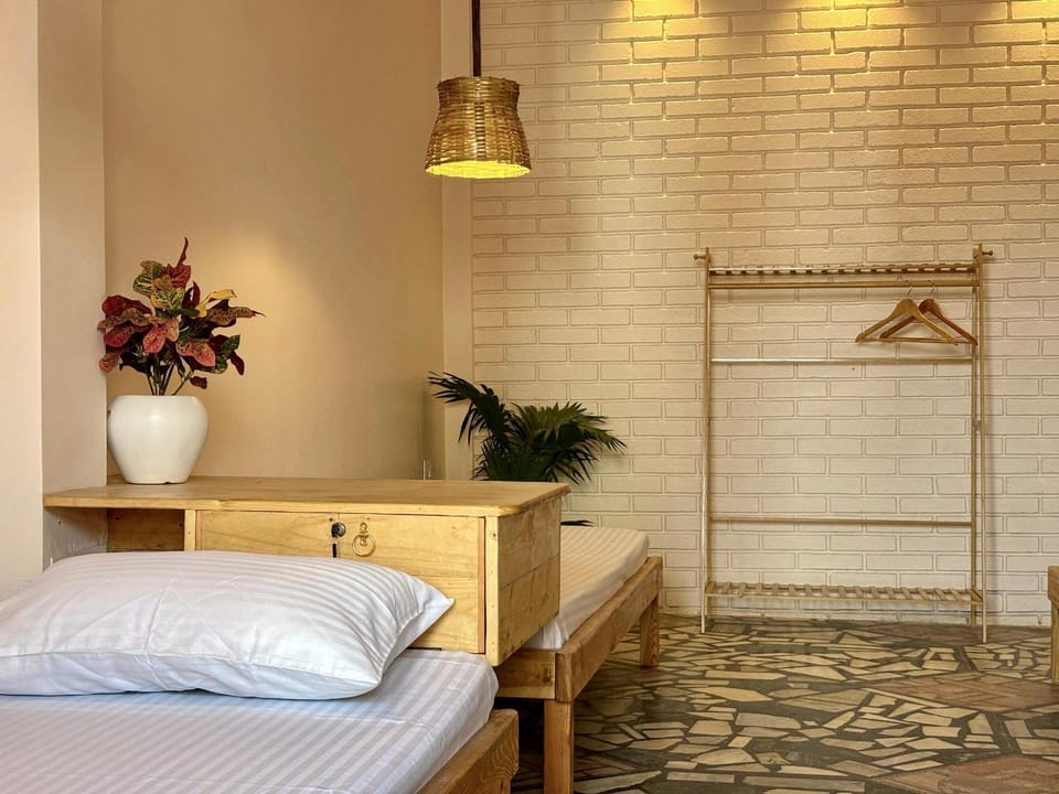 Bed, Photo of the whole room, Bedroom, hair dryier, towels, air conditioner