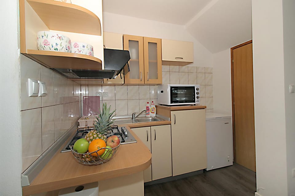Kitchen or kitchenette, stove, kitchen