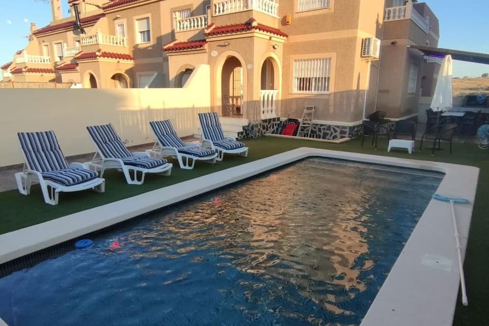Property building, Day, Pool view, Swimming pool, sunbed