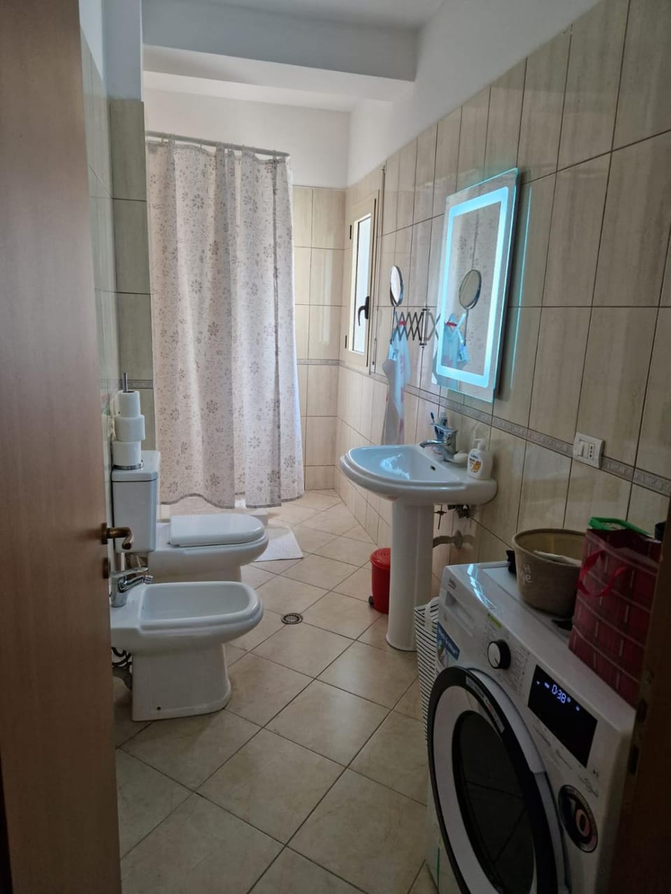 Shower, Toilet, Bathroom, bidet, towels, washing machine, dryer