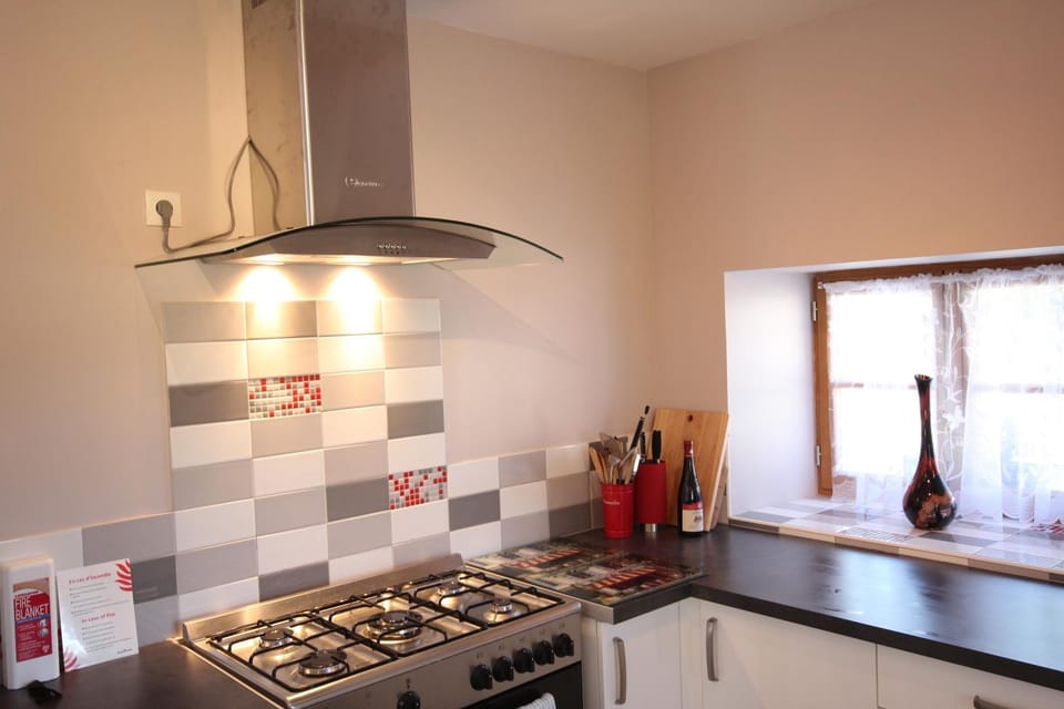 Kitchen or kitchenette, dishwasher, microwave, stove, toaster