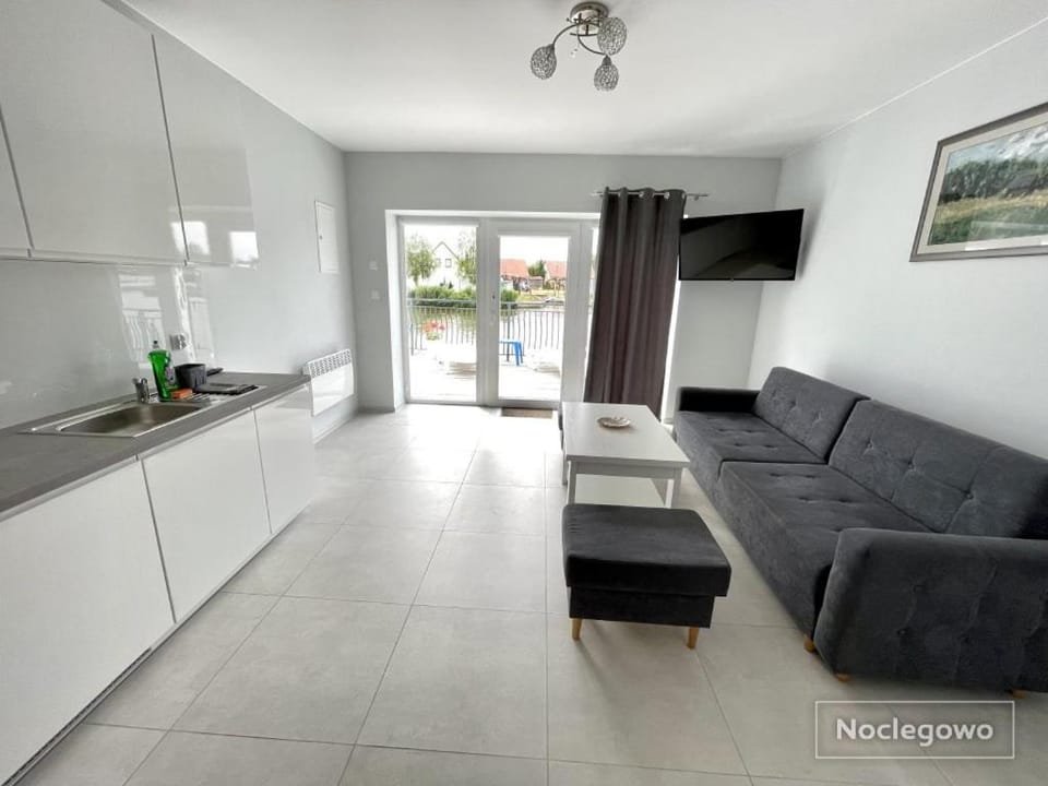 Ostoja Nad Rzeką Apartment in Leba