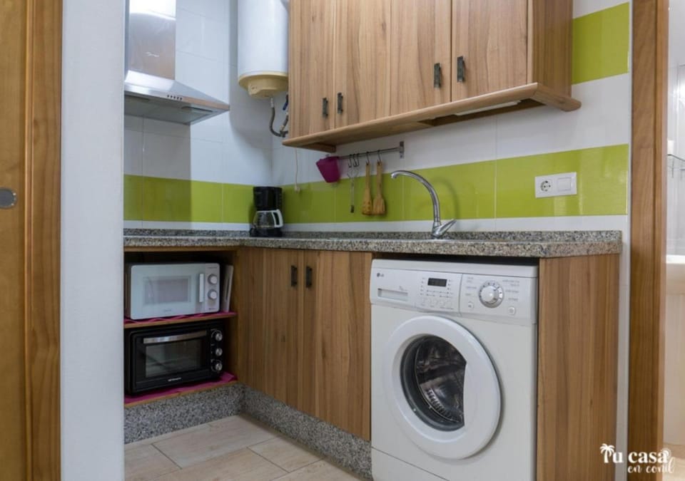 Kitchen or kitchenette, stove, washing machine