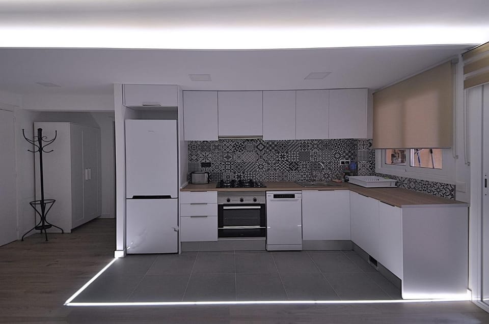 Kitchen or kitchenette, dishwasher, oven, stove