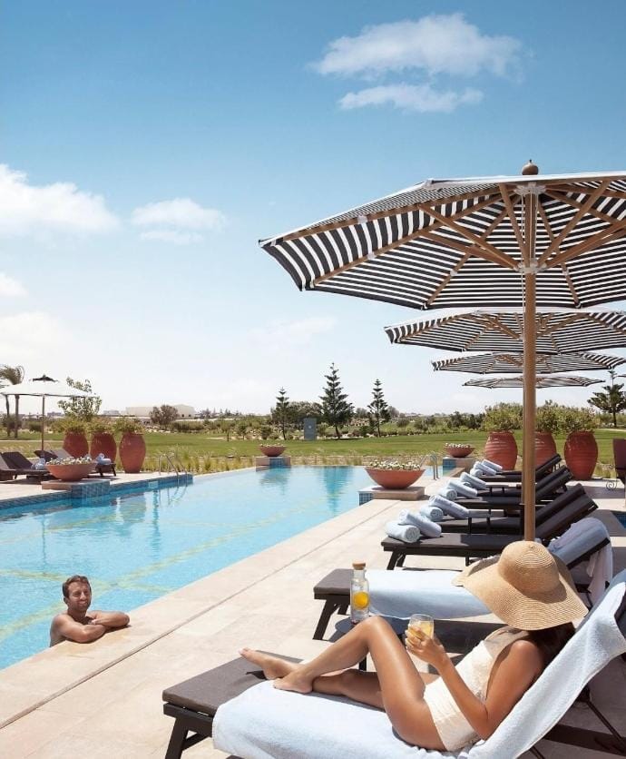 People, Natural landscape, Pool view, Swimming pool, sunbed