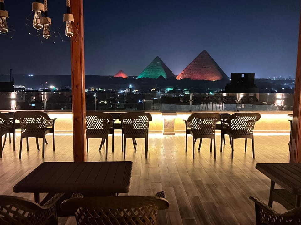 Restaurant/places to eat, Night, View (from property/room), Balcony/Terrace, Seating area, City view, Landmark view