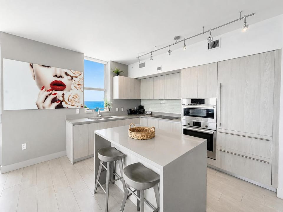 Kitchen or kitchenette, dishwasher, oven, stove