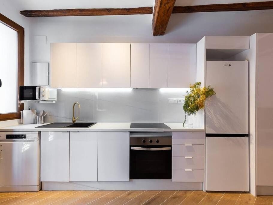 Kitchen or kitchenette, dishwasher, oven, stove, toaster