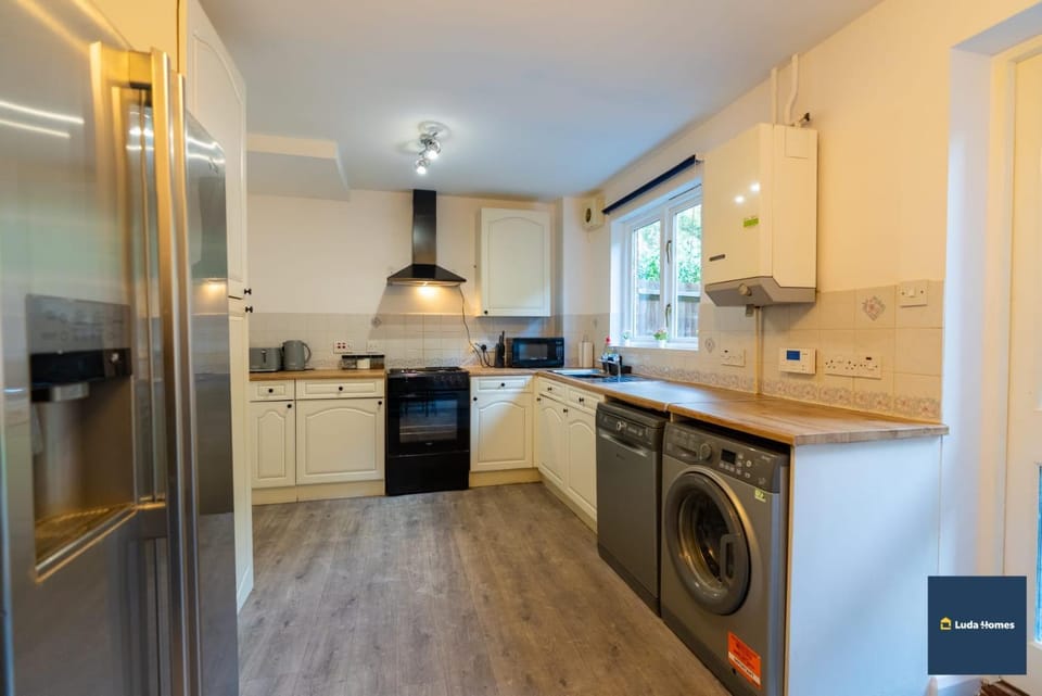 Kitchen or kitchenette, dishwasher, oven, stove, washing machine, dryer