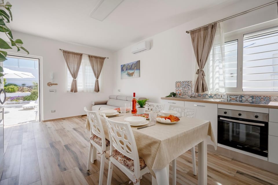 Kitchen or kitchenette, Seating area, Dining area, oven, stove, air conditioner