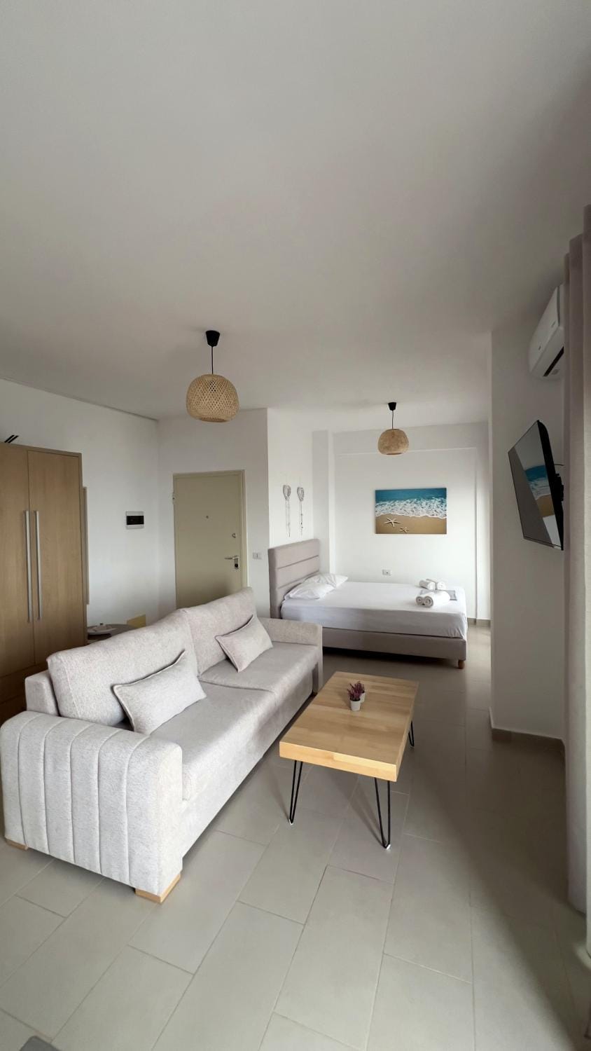 Bed, TV and multimedia, Seating area, wardrobe