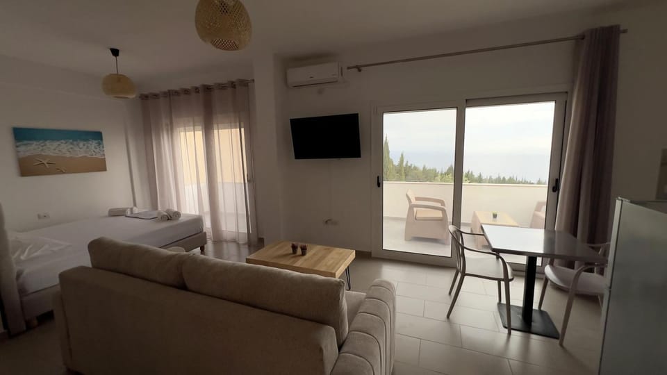 TV and multimedia, Living room, Seating area, Sea view, air conditioner