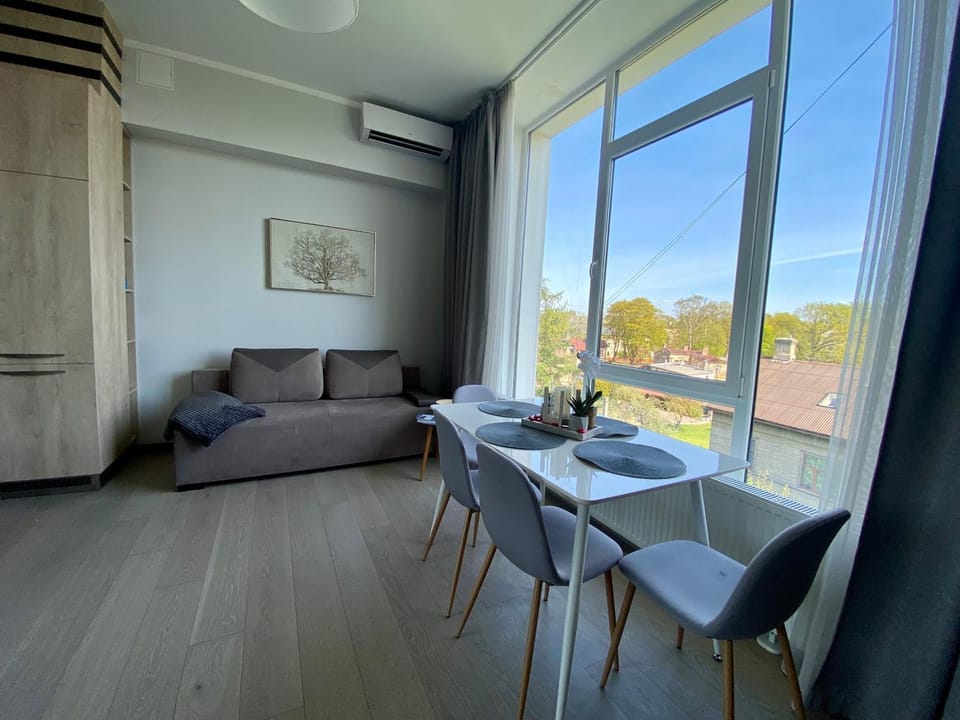 View (from property/room), Living room, Seating area, Dining area, Garden view, air conditioner