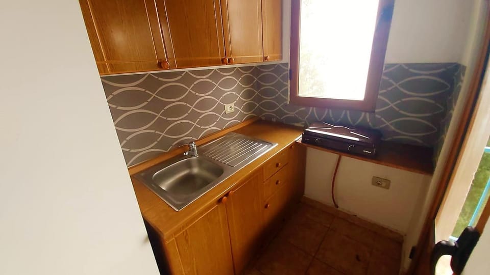 Kitchen or kitchenette, stove