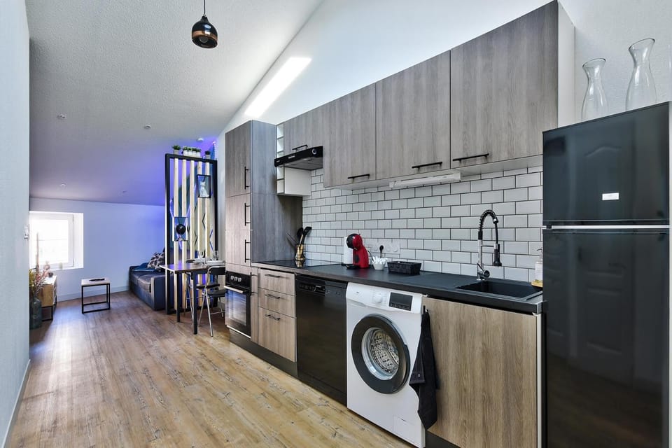 Kitchen or kitchenette, dishwasher, oven, stove, toaster, washing machine
