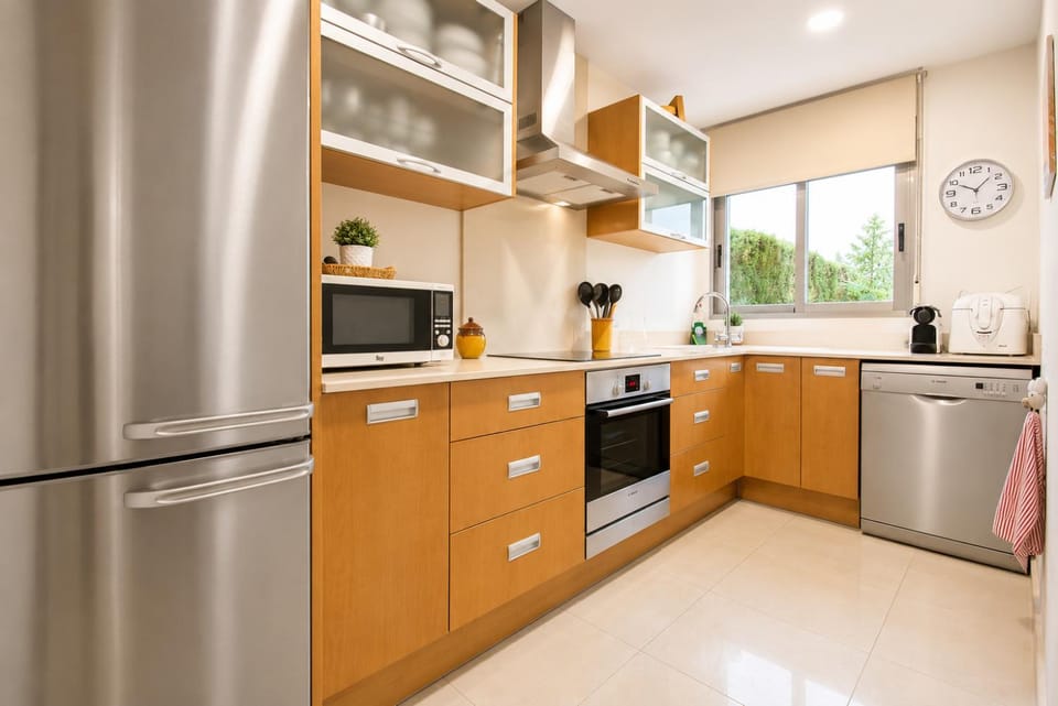 Kitchen or kitchenette, dishwasher, microwave, oven, stove