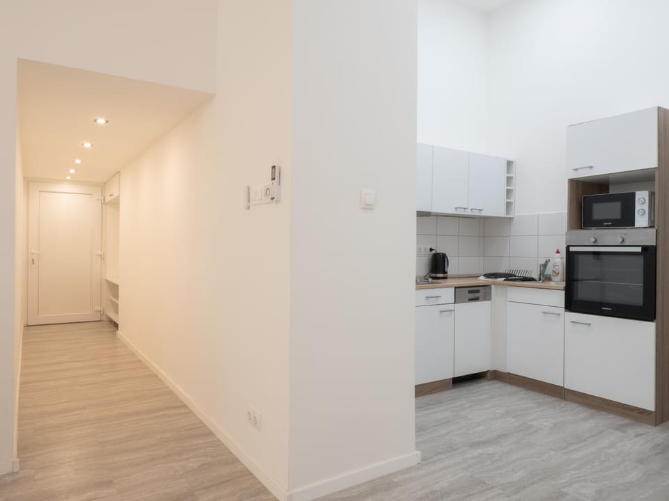 Kitchen or kitchenette, dishwasher, oven, stove