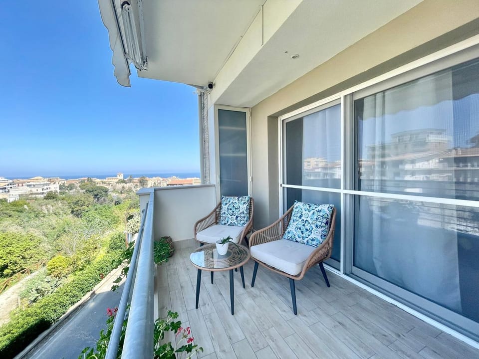 Property building, Patio, Day, View (from property/room), Living room, Seating area, Sea view