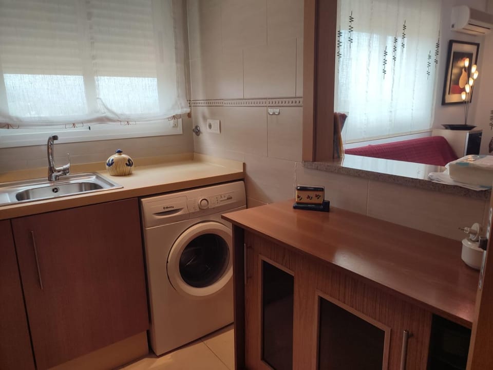 Kitchen or kitchenette, washing machine