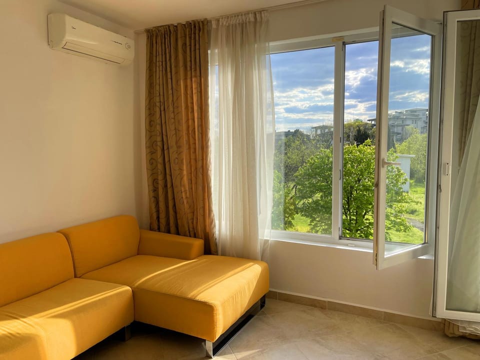 View (from property/room), Living room, Seating area, air conditioner