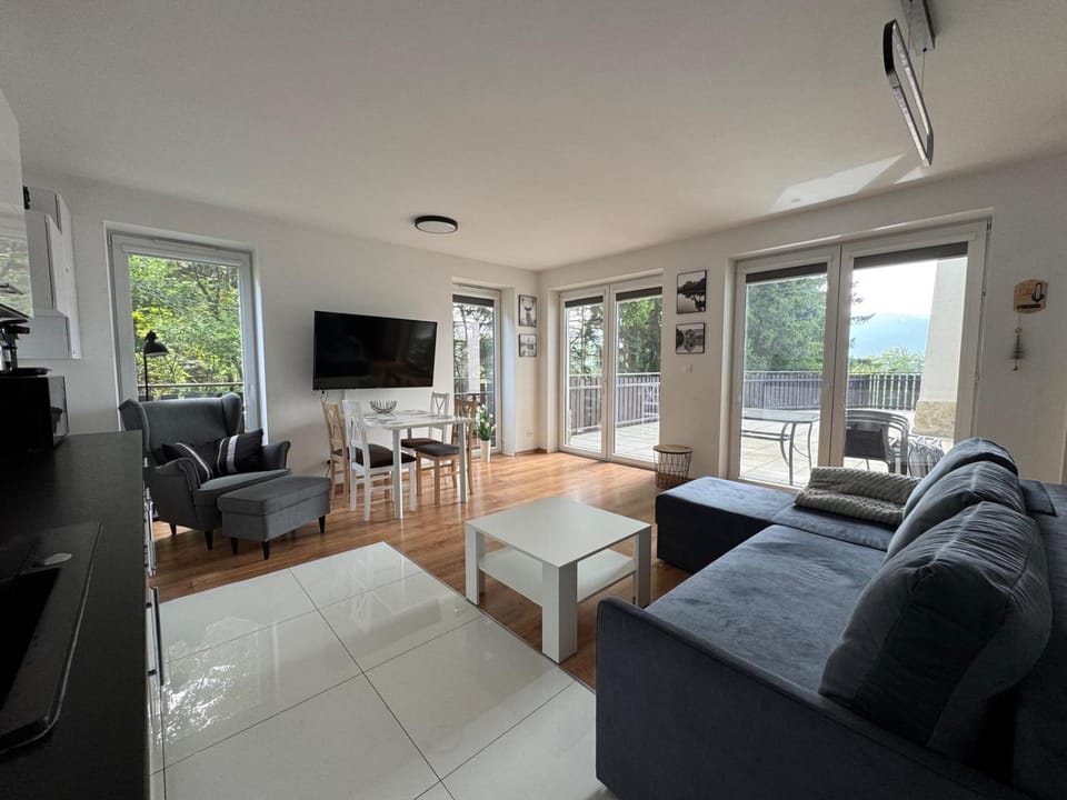 Off site, View (from property/room), Balcony/Terrace, Photo of the whole room, Text overlay, Mountain view, Mountain view, Family, furniture, stove, kitchen