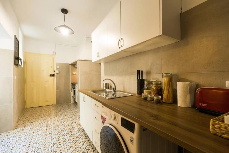 Kitchen or kitchenette, oven, stove, washing machine